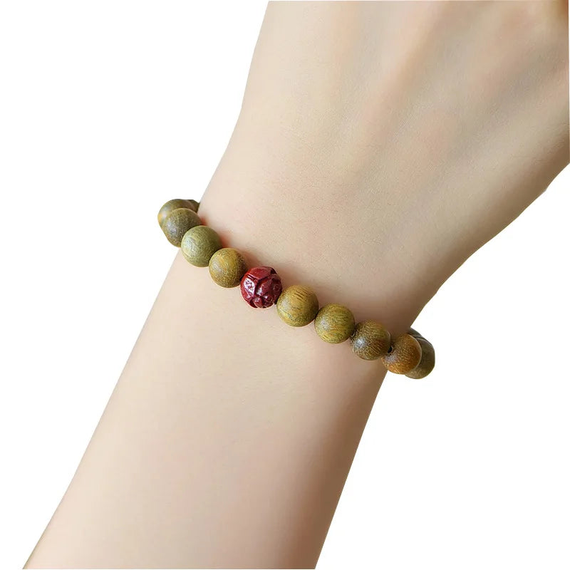 Green Sandalwood Beaded Bracelet with Cinnabar Lotus Bead