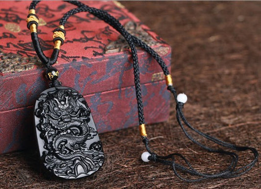 Carved Obsidian Dragon Pendant With Four Pieces