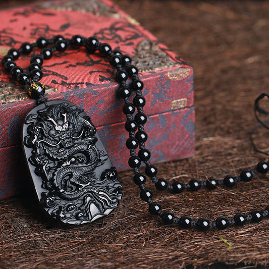 Carved Obsidian Dragon Pendant With Four Pieces
